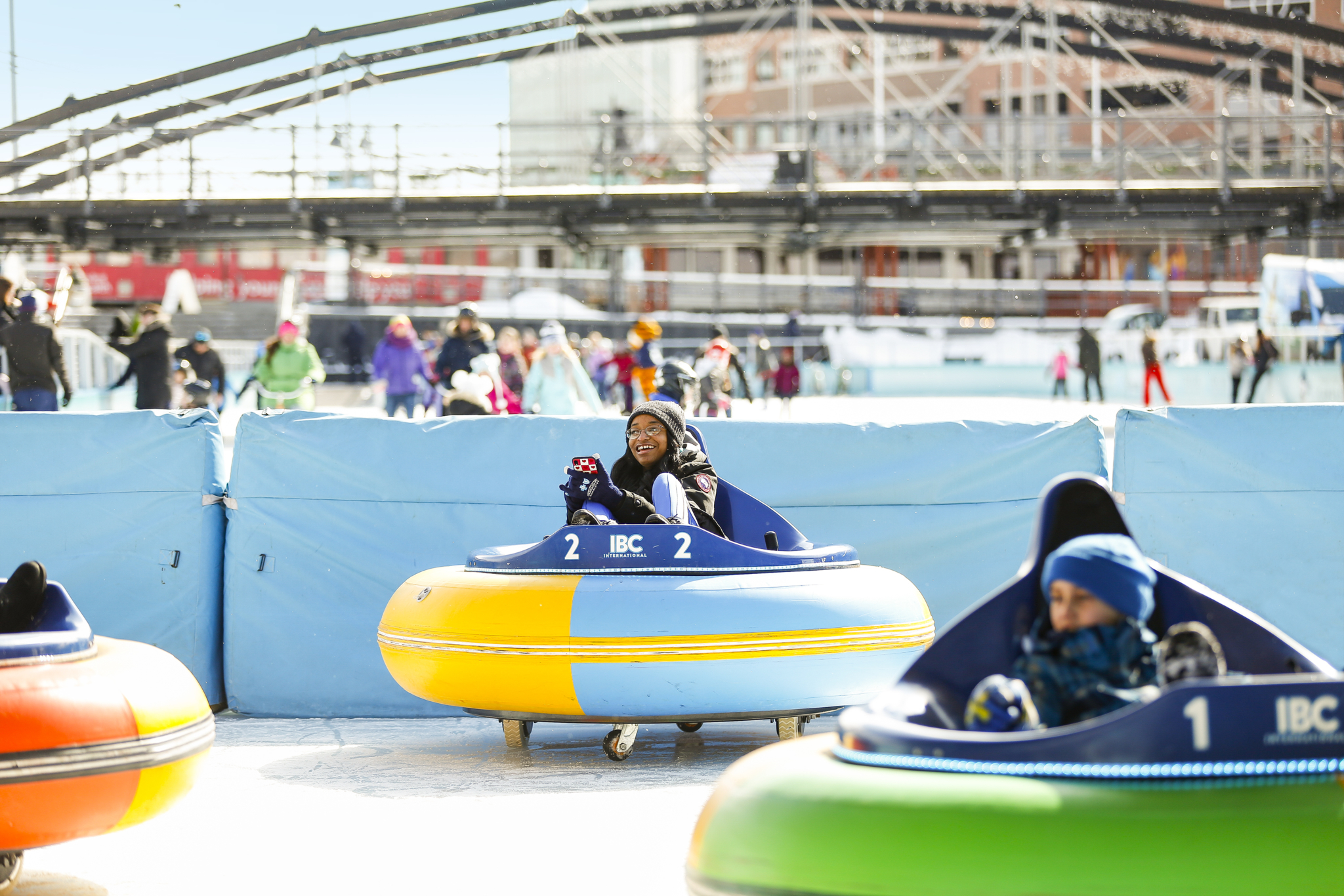 Woman in Bumper Car on Ice Rink