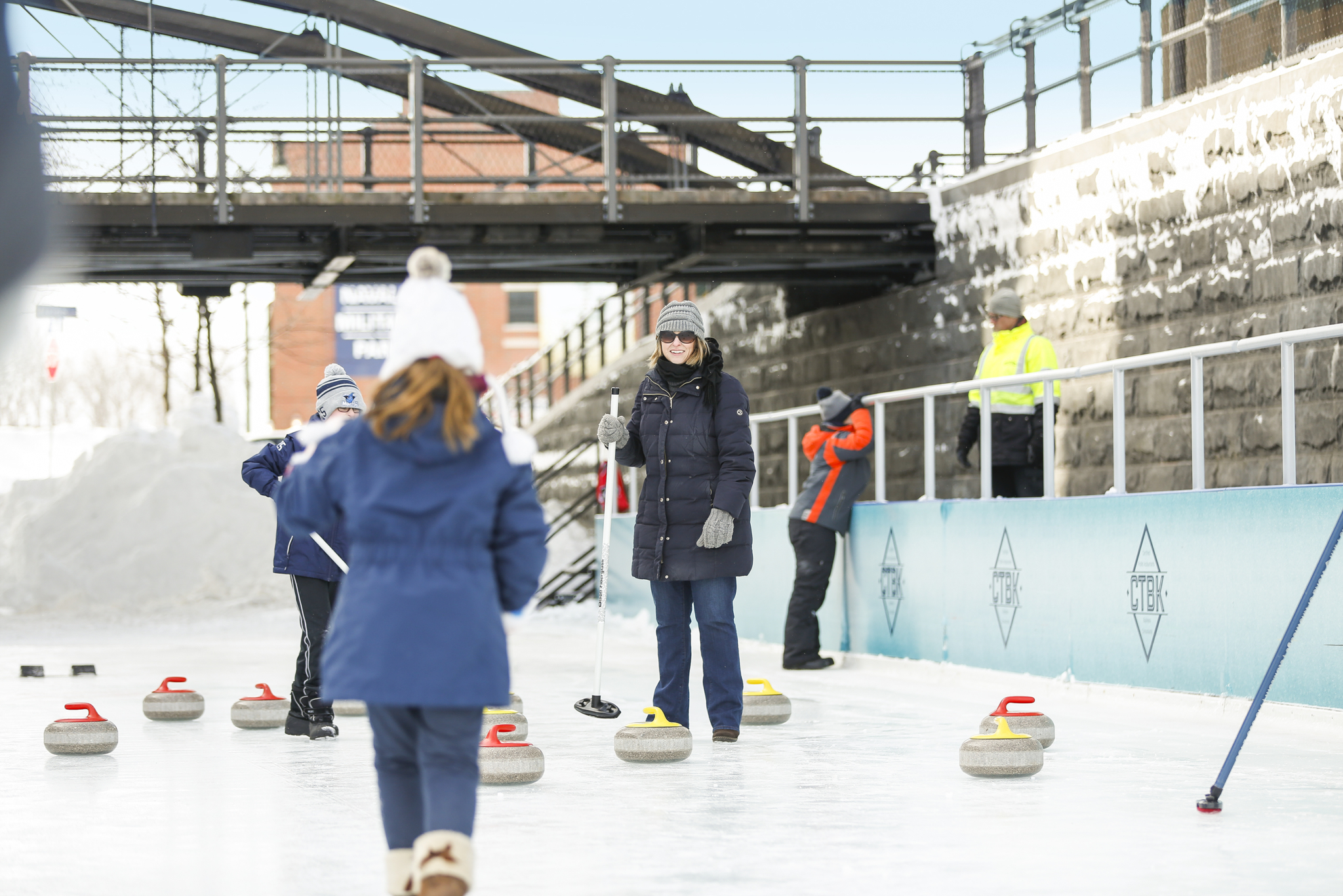 Family Curling on Ice Rink